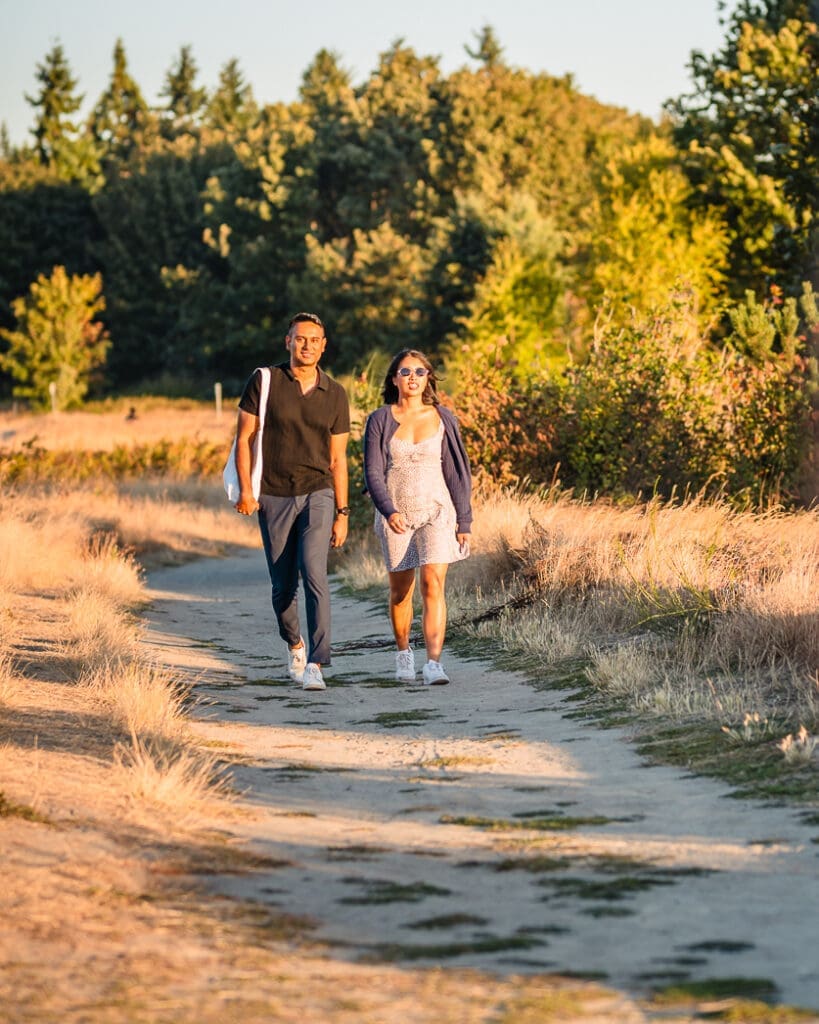 About to be engaged couple just spotted heading towards the Discovery Park viewpoint in Seattle. Photographer Mae Lans Photography gets ready for the surprise!