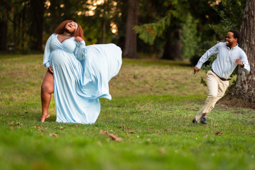 One in a series of photographs of what appears to be a time lapse of the husband letting go of the trail of his wife's dress after tossing it in the air. The resulting photographs show pure joy and laughter against the golden sunset.