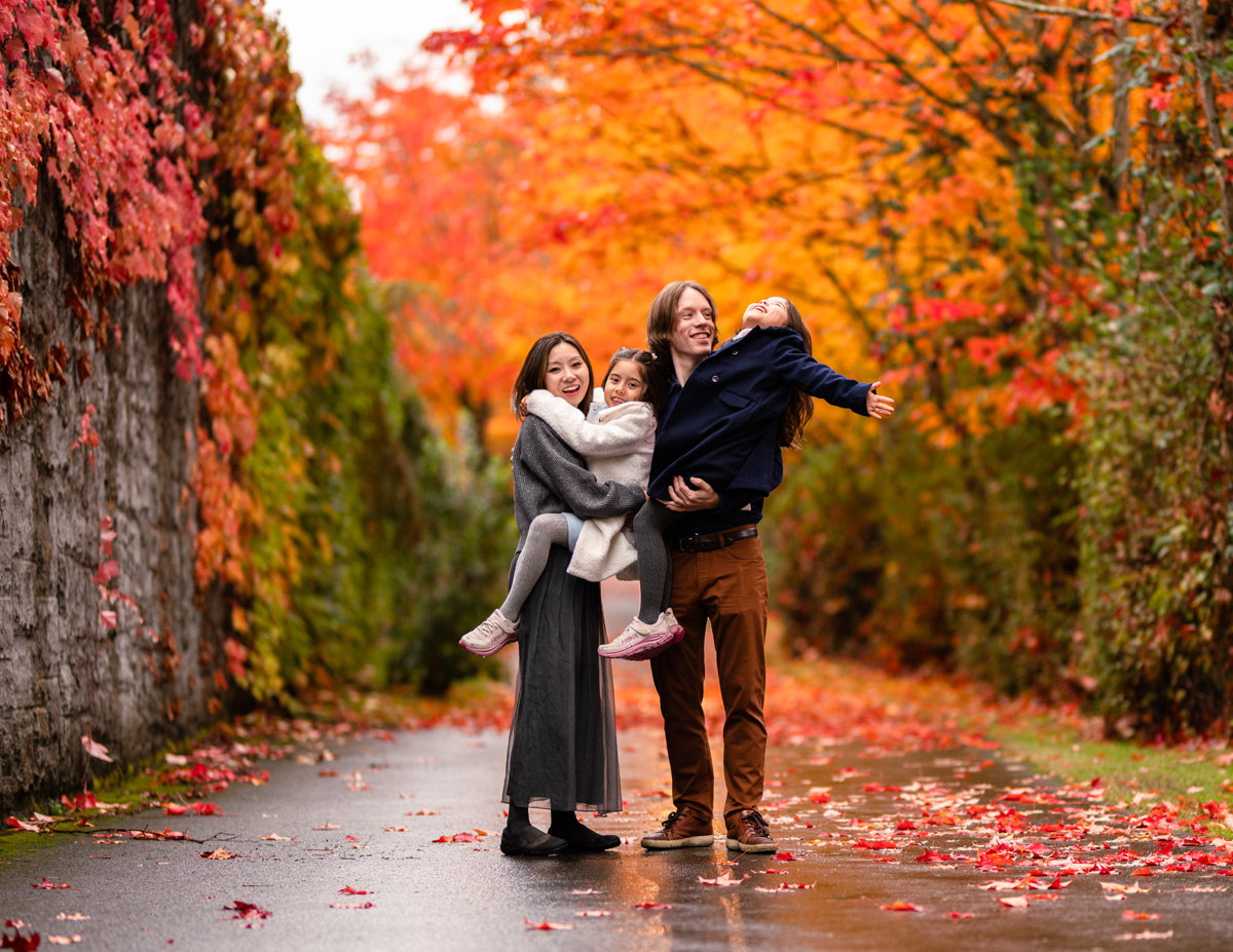 A family of four showing delight during their fall family photoshoot near Seattle, Washington.